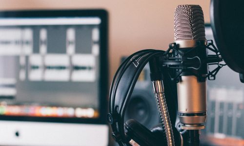 black and silver headphones on black and silver microphone